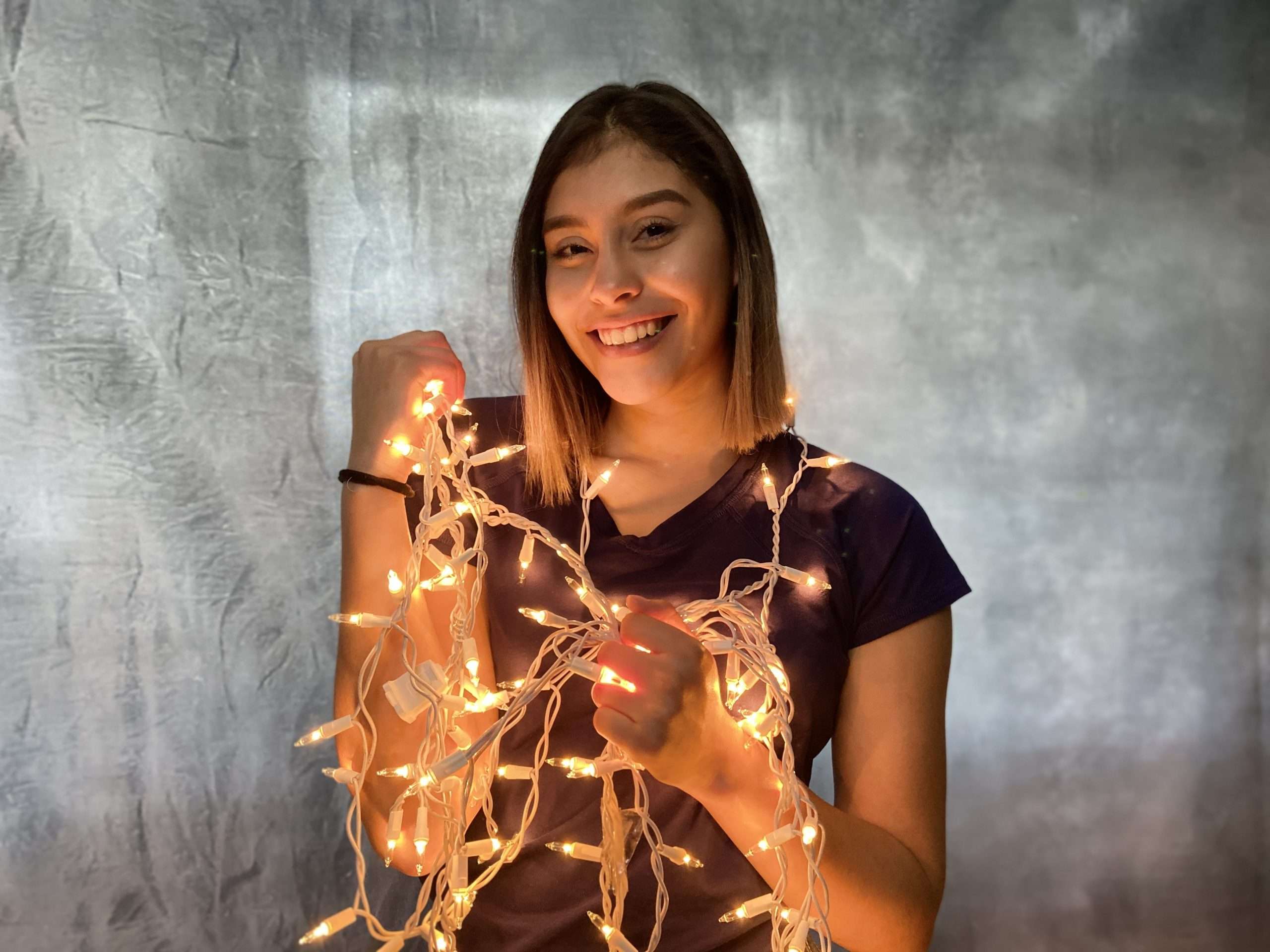picture of a girl holding lights