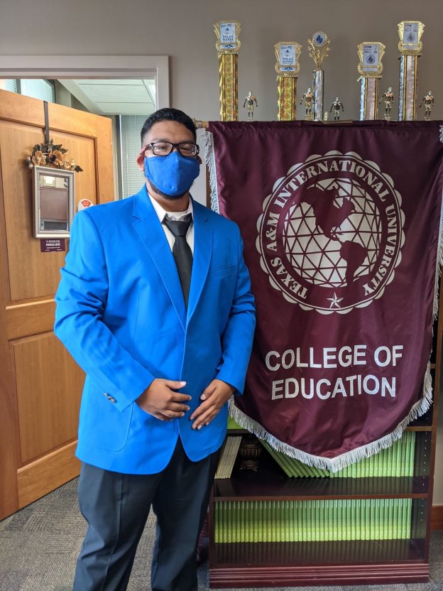 A picture containing text, person, indoor, blue Description automatically generated