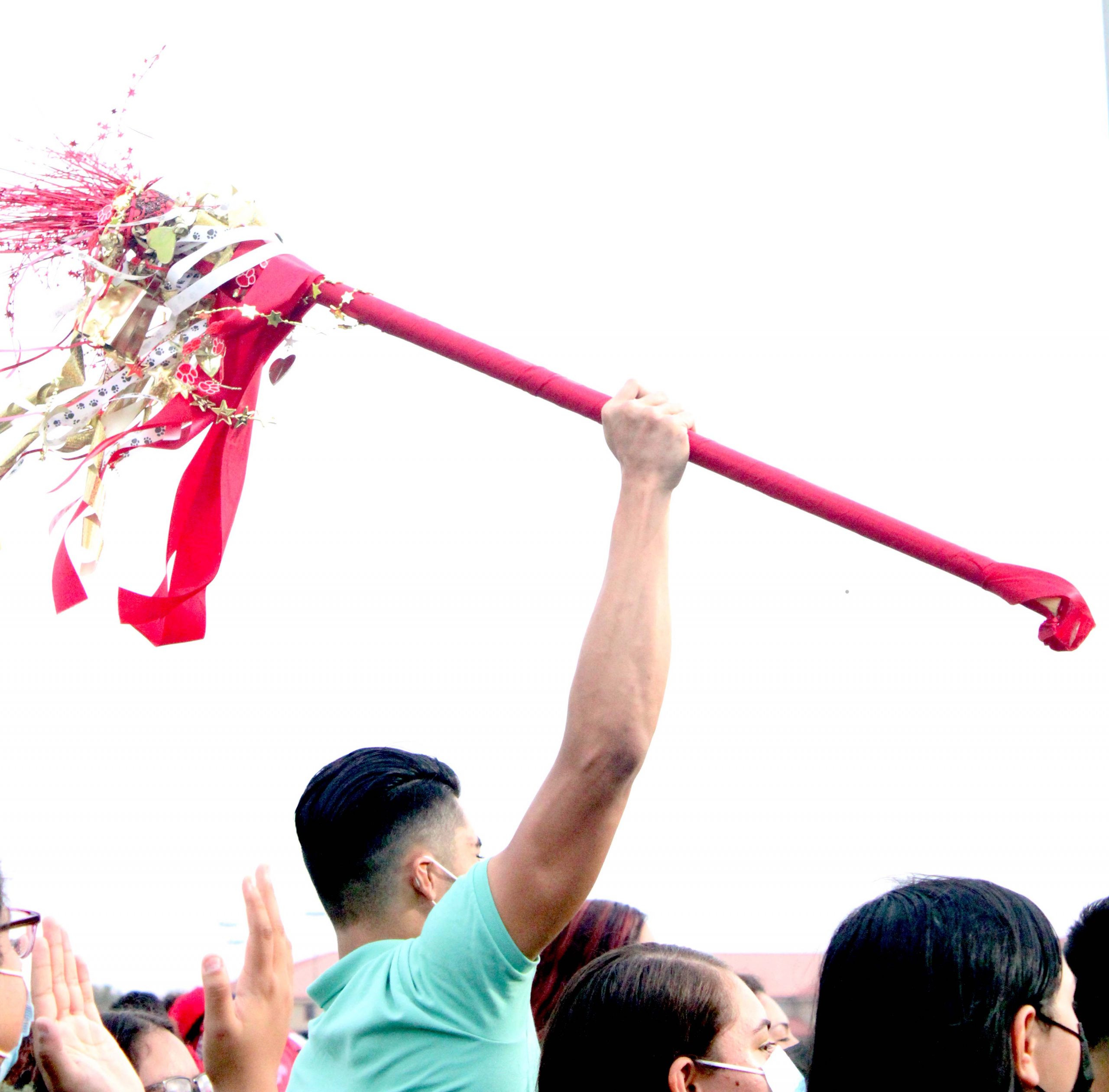 Jr, Rene Salinas raises the school's spirit stick.