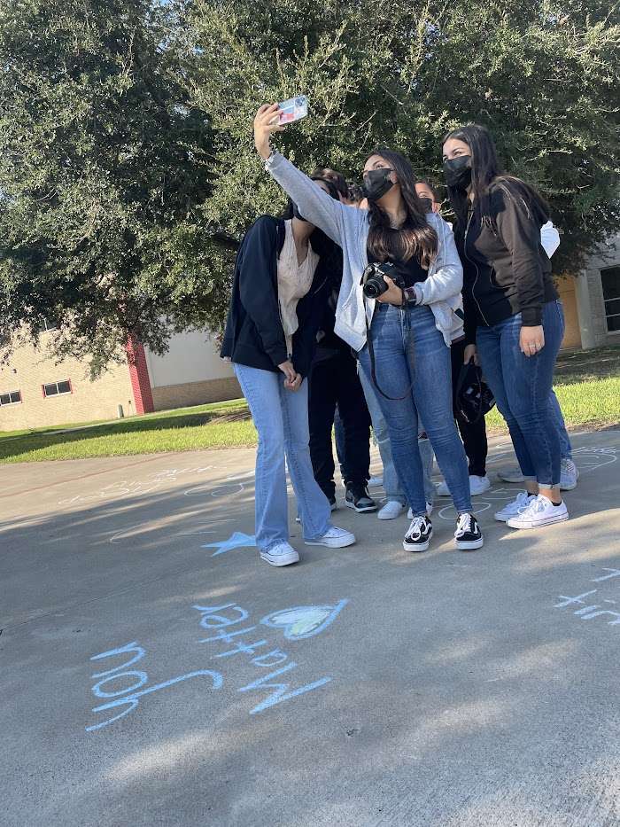 Group of Teens taking a selfie in front on Suicide Prevention messages