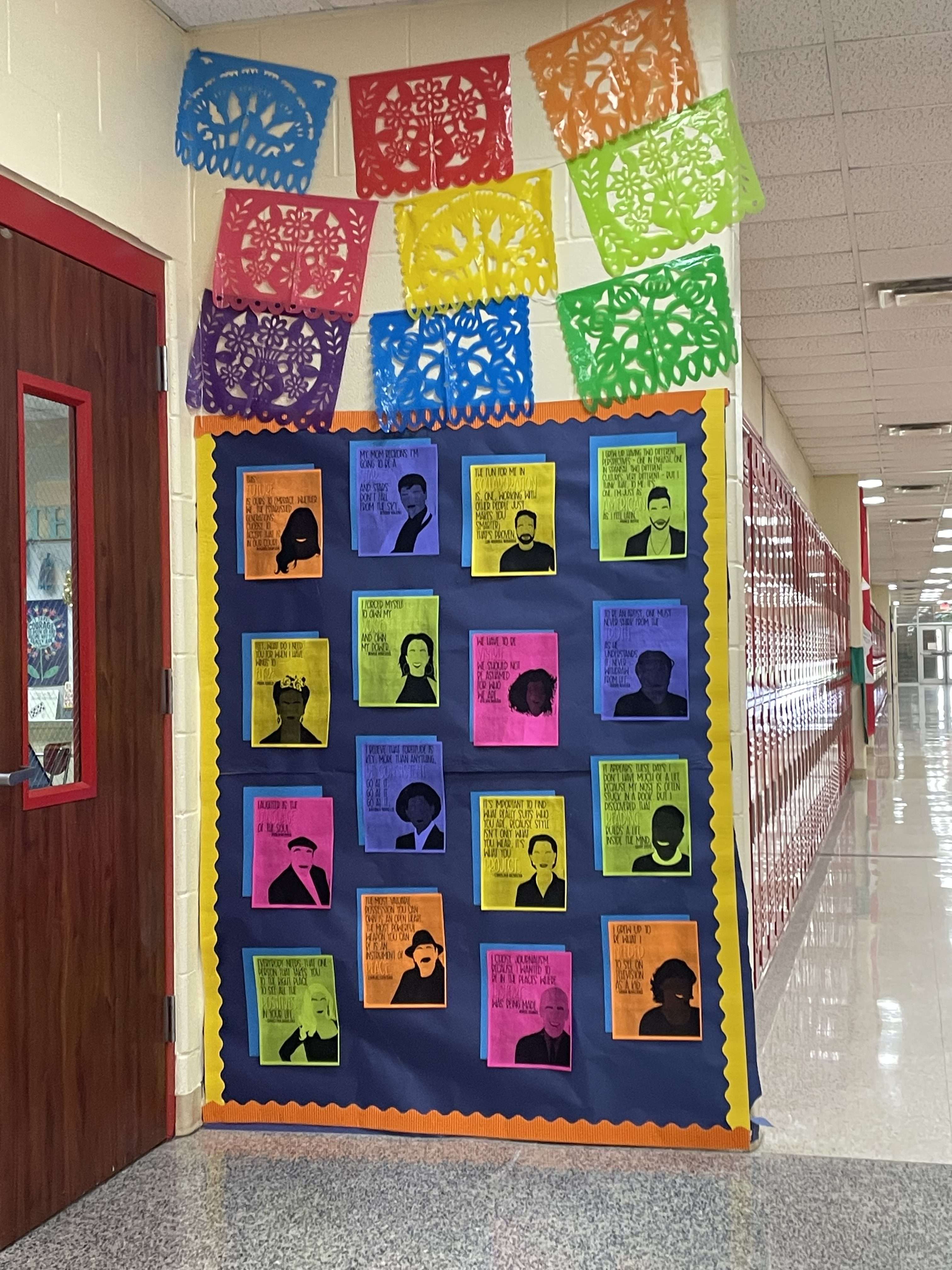 Hispanic Heritage Display with colorful paper flags and Hispanic figures.