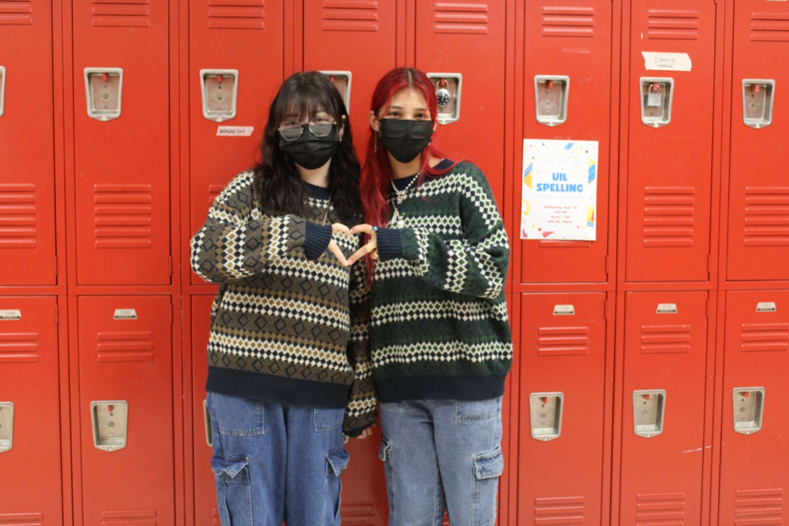 Two students wear a stripped, green matching sweater for Day 3 of Bullying prevention week.