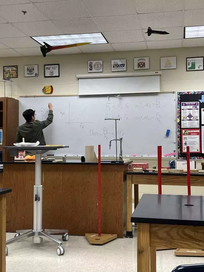 Man writing on whiteboard