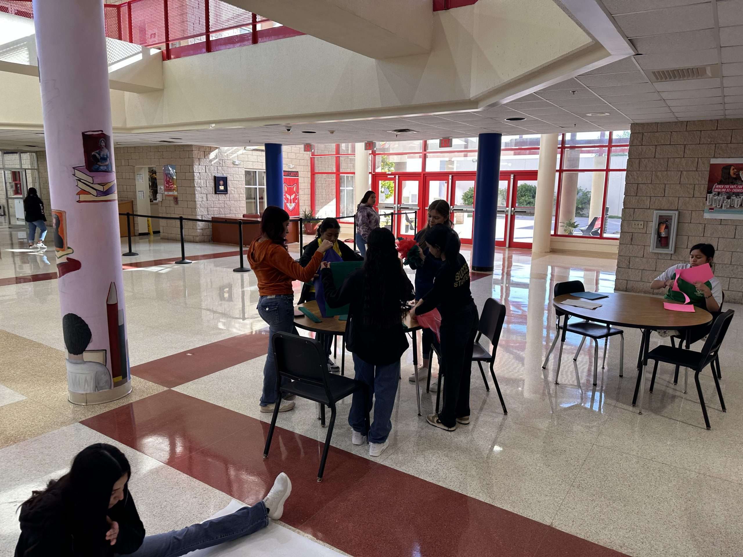 Senior students at Jimmy Carter ECHS adorn the campus in vibrant colors